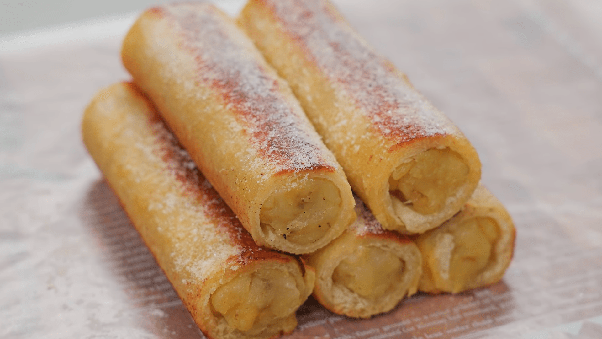 Banana roll with Nutella spread and chopped hazelnuts wrapped in a tortilla.