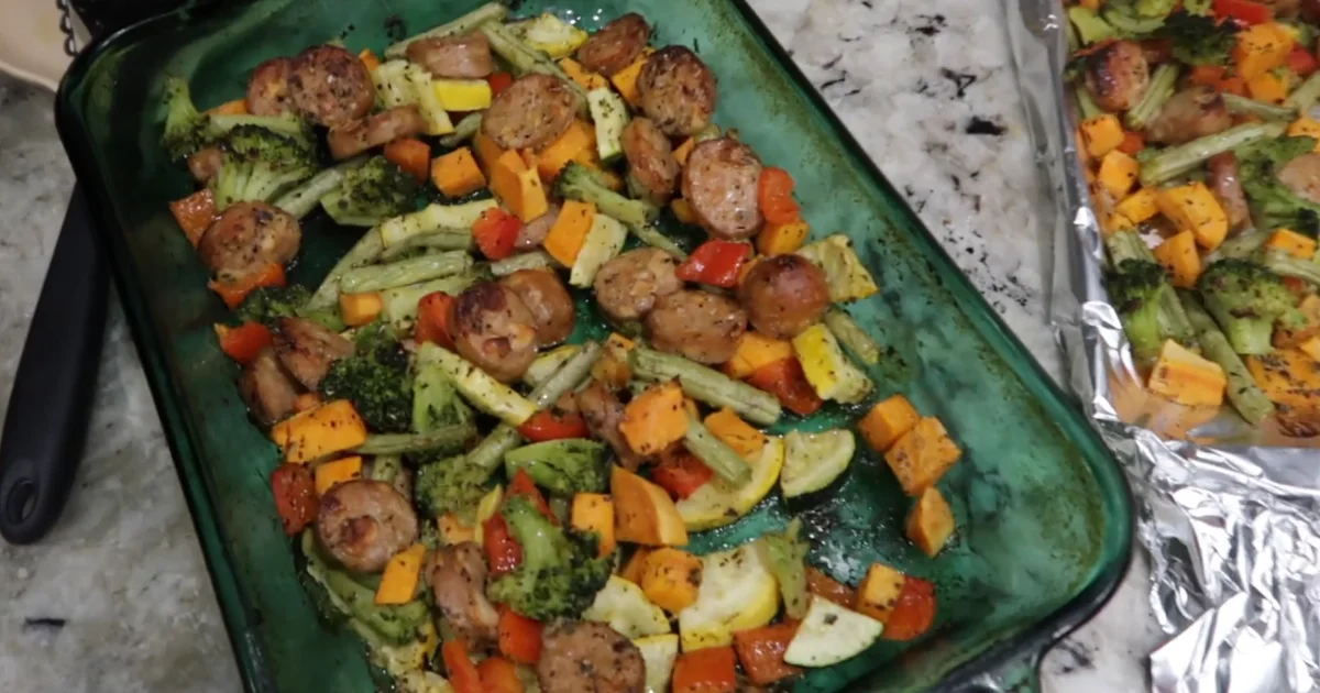 A delicious chicken sausage sheet pan meal with roasted vegetables and sausage slices, perfect for a quick and healthy dinner.