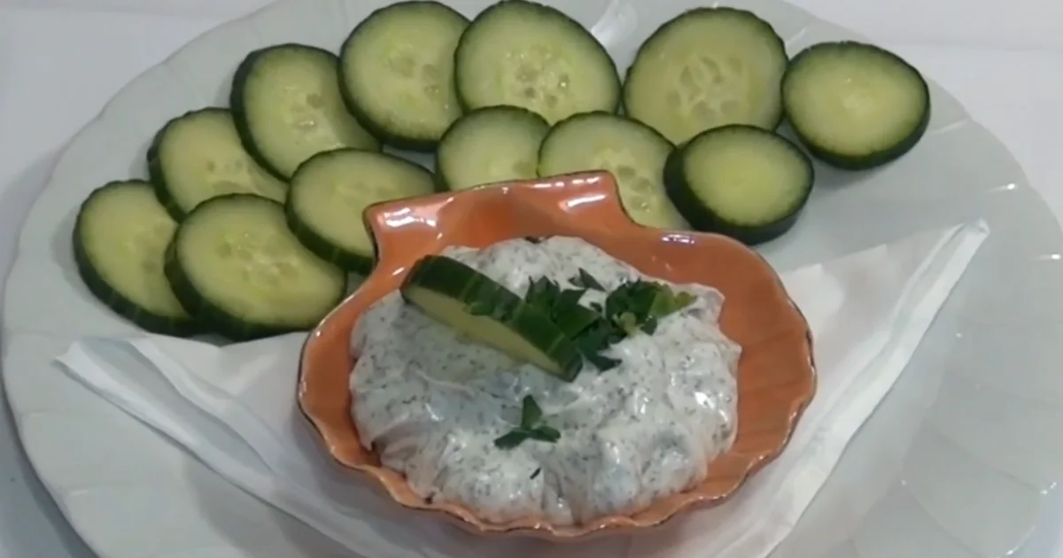 Delicious homemade cucumber dip with fresh ingredients served in a bowl.