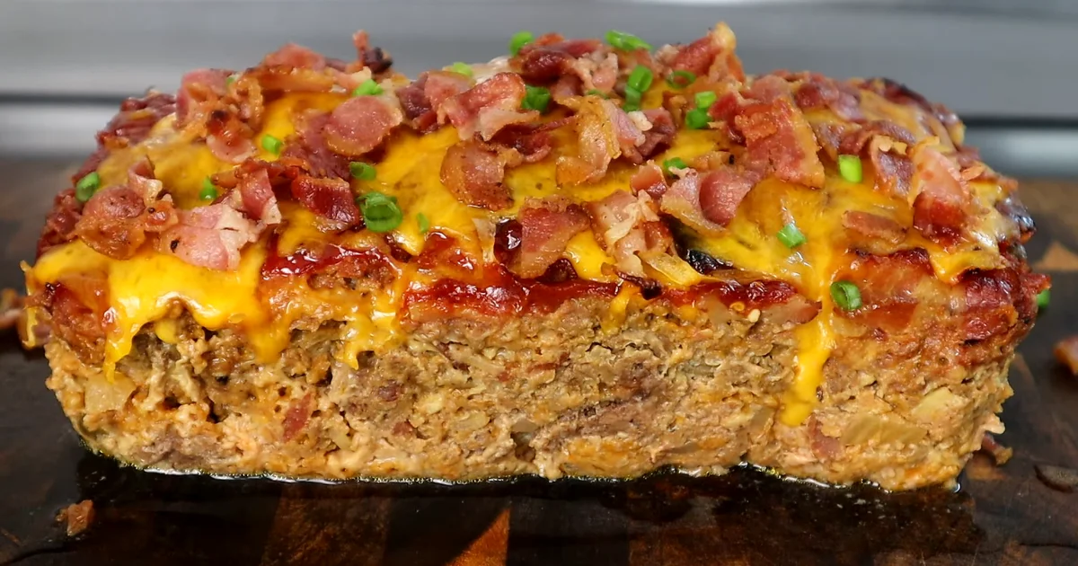 Bacon Cheeseburger Meatloaf with crispy bacon and melted cheese on top.