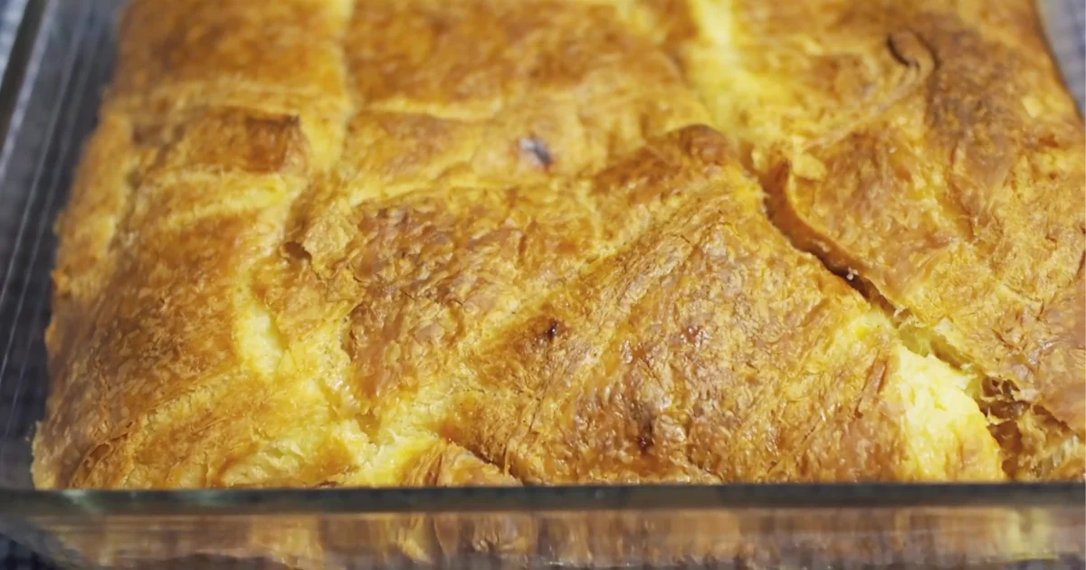 Golden, warm croissant bread pudding with a creamy custard topping.