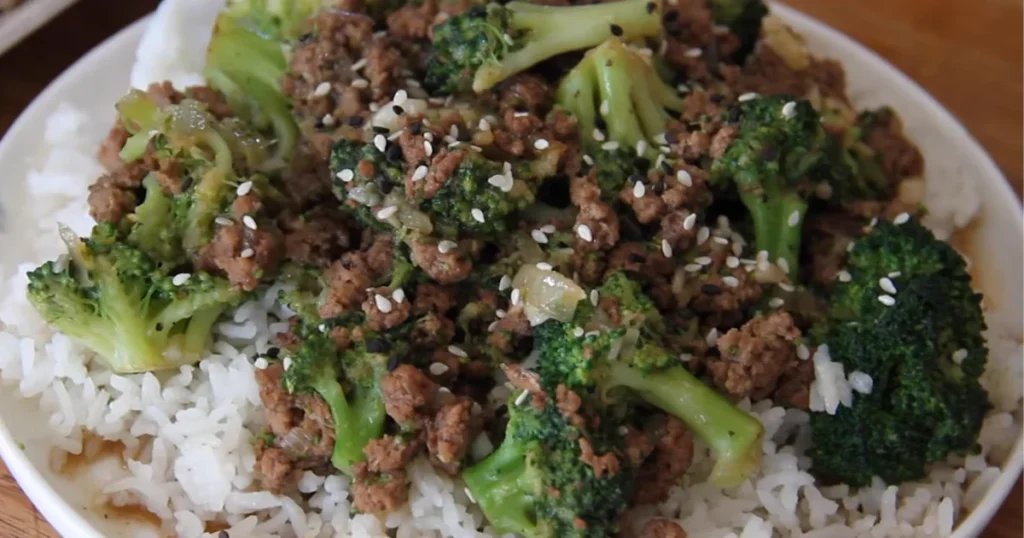 A delicious plate of ground beef and broccoli stir-fry, served with a savory sauce.