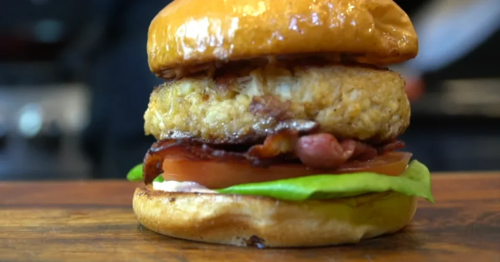 A delicious Crab Cake Sandwich with crispy crab cakes, fresh lettuce, and toasted brioche buns.