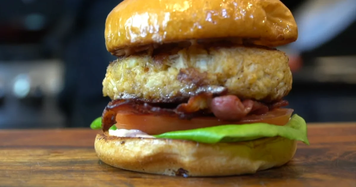 A delicious Crab Cake Sandwich with crispy crab cakes, fresh lettuce, and toasted brioche buns.